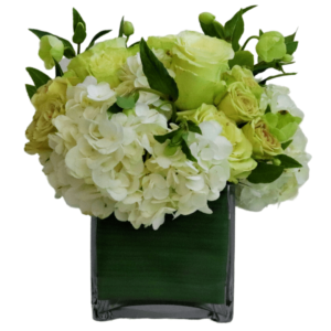 This beautiful compact vase arrangement is designed with roses and primium highend flowers.